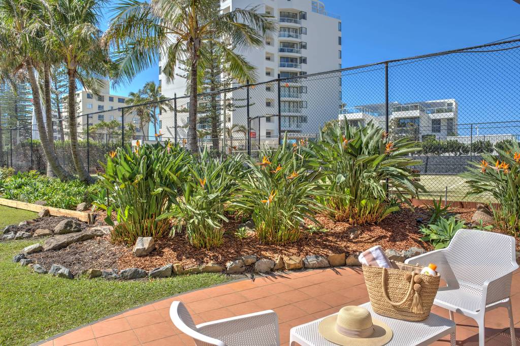 Gardens patio with white outdoor chairs