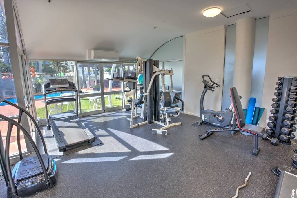 Gym with treadmills and weight rack
