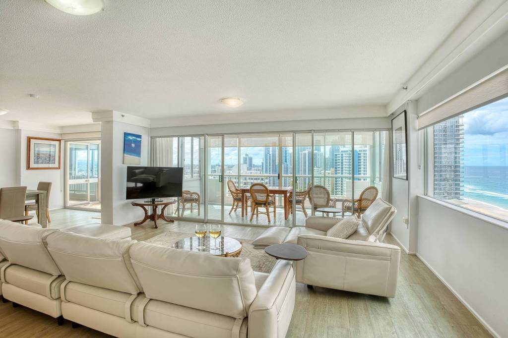 2 Bedroom Superior – cream-sofa lounge with Pacific outlook
