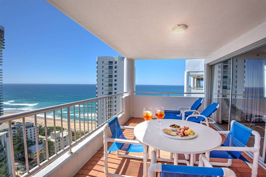 2 Bedroom Superior – balcony dining with beach panorama