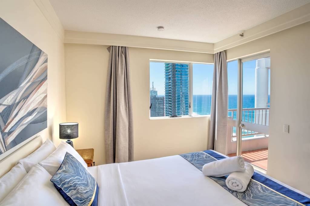 2 Bedroom Superior – bedroom with ocean-view glass doors
